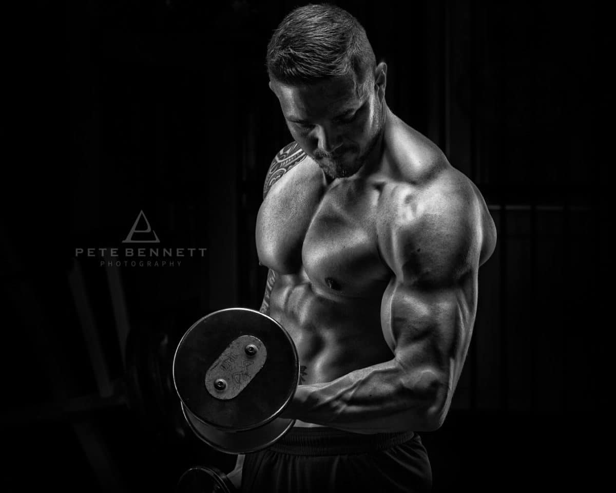Black and white image of dean dark body building photoshoot