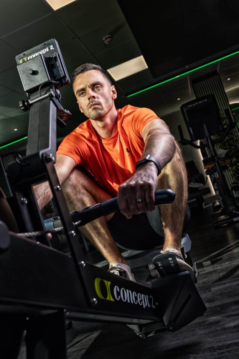 Athlete on a rowing machine at a fitness event