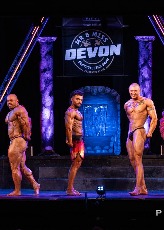 Men's bodybuilding comparison on stage at Mr & Miss Devon 2026 in Plymouth